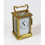 An early 20th century lacquered brass cased carriage clock, having enamelled dial with Roman