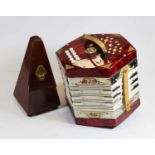 A German Scholer accordion together with a French Paquet mahogany cased metronome, height 23cm