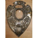 A large late Victorian silver plate on copper shield shaped trophy mount, having repousee floral