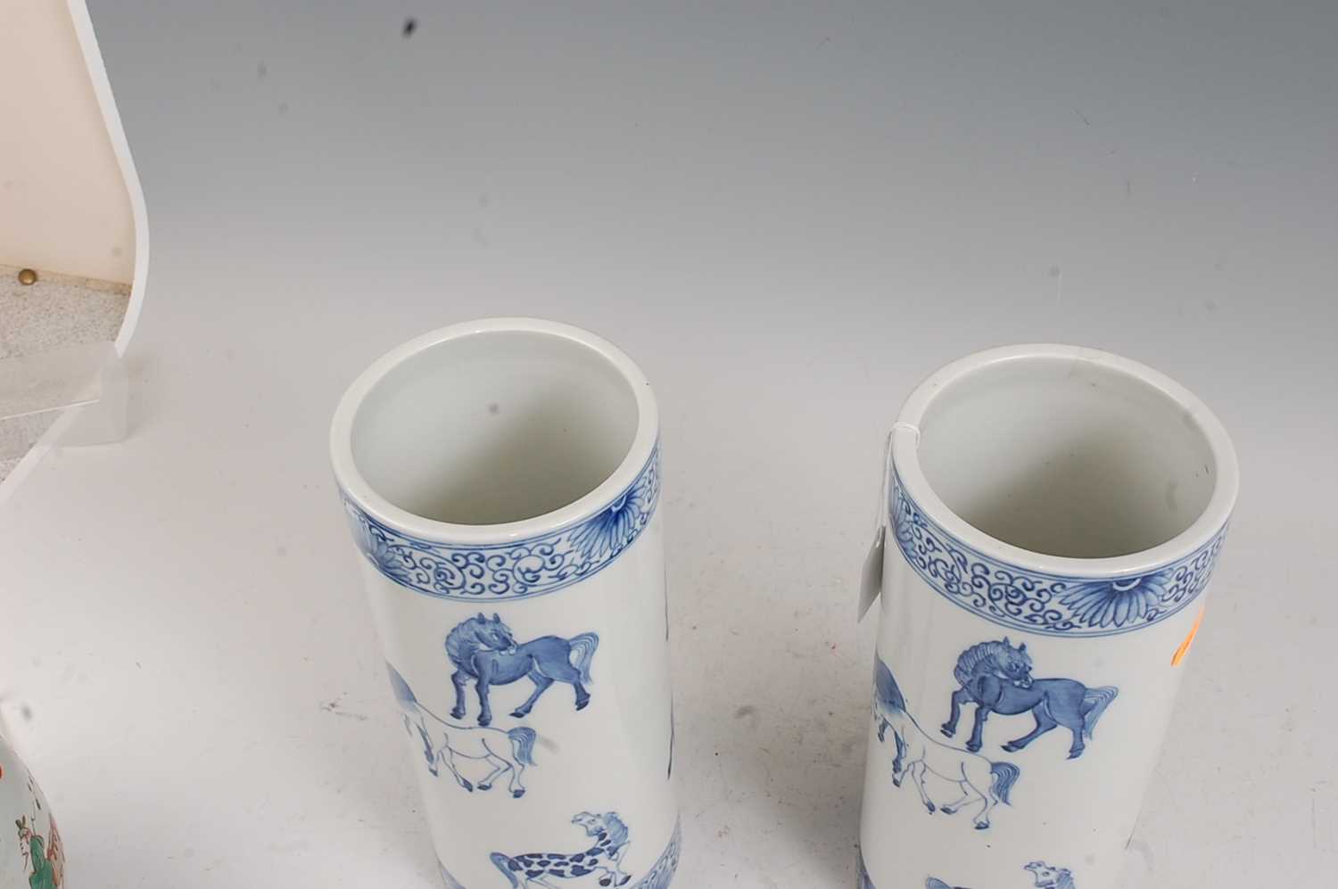 A pair of Chinese blue & white vases each of cylindrical form decorated with various horses within - Image 4 of 5