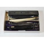 A Cougar Cutter cut throat razor having a folding steel blade and faux ivory handle in original box,