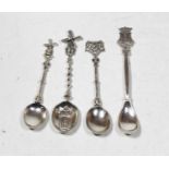 Four various Dutch silver souvenir spoons, one being Gravenhage, two Amsterdam, and one other,
