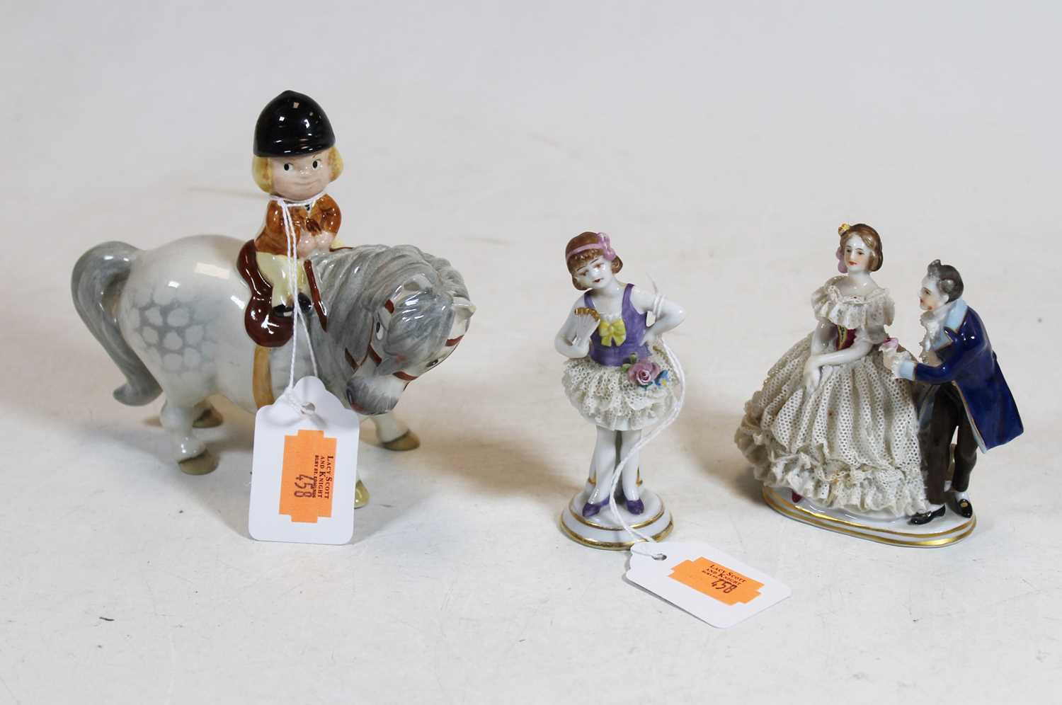 A Beswick Thelwell girl on pony, boxed; together with two Continental figures (3)`