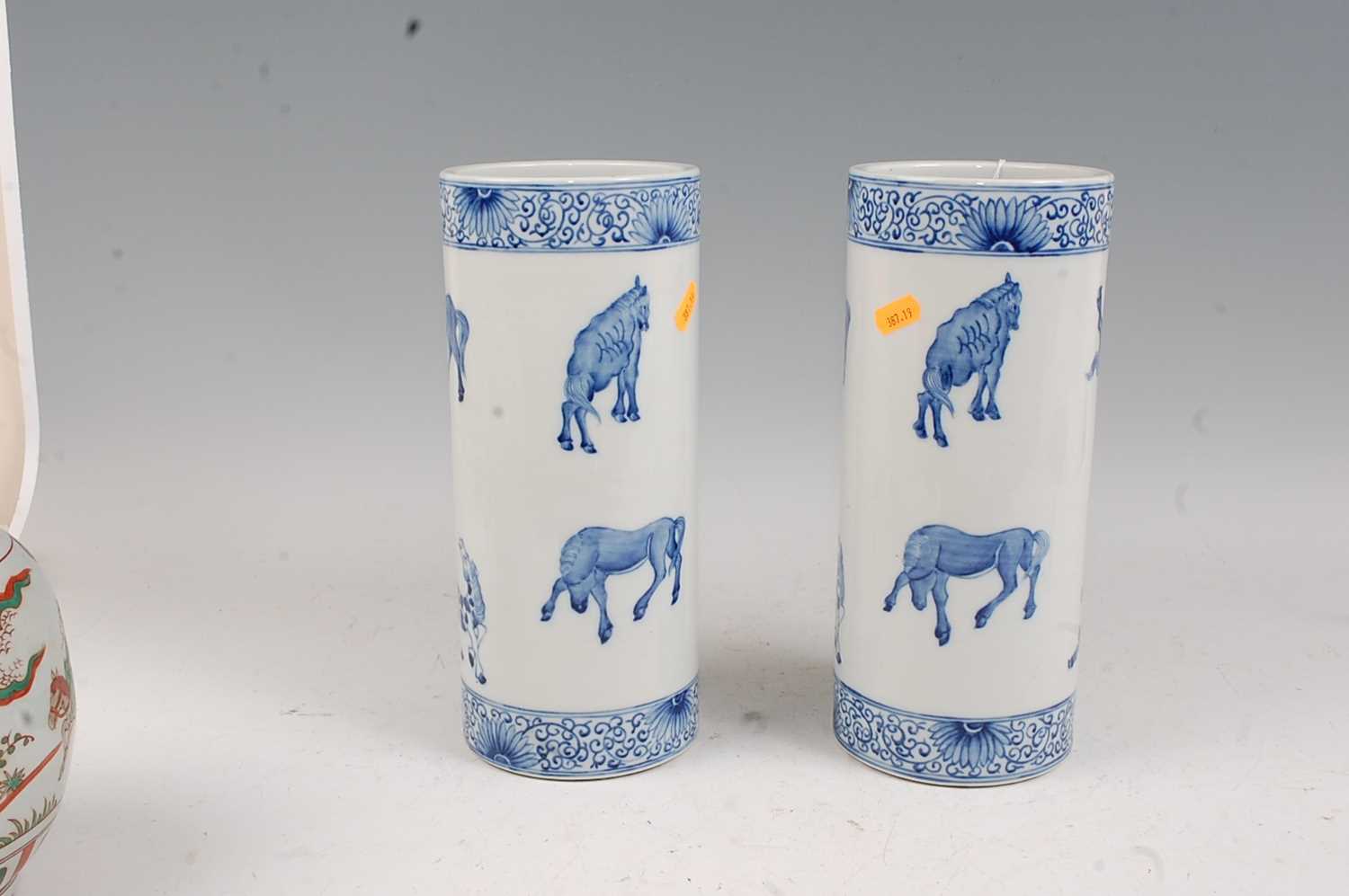 A pair of Chinese blue & white vases each of cylindrical form decorated with various horses within - Image 2 of 5