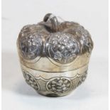 An early 20th century Indian white metal spice jar and cover, in the form of an apple, having