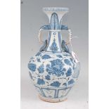 A Chinese export blue & white vase having a flared rim to a slender neck with elephant trunk handles