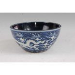A Chinese export stoneware bowl having a plain blue interior, the exterior decorated with a five