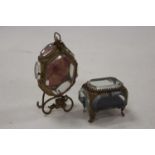 A gilt metal and bevelled glass pocket watch holder having leaf and berry decoration, height 14cm,