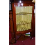 An early 20th century mahogany serpentine front single door glazed corner cabinet, width 76.5cm