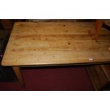 A Victorian plank topped pine round cornered narrow farmhouse kitchen table, on square tapering