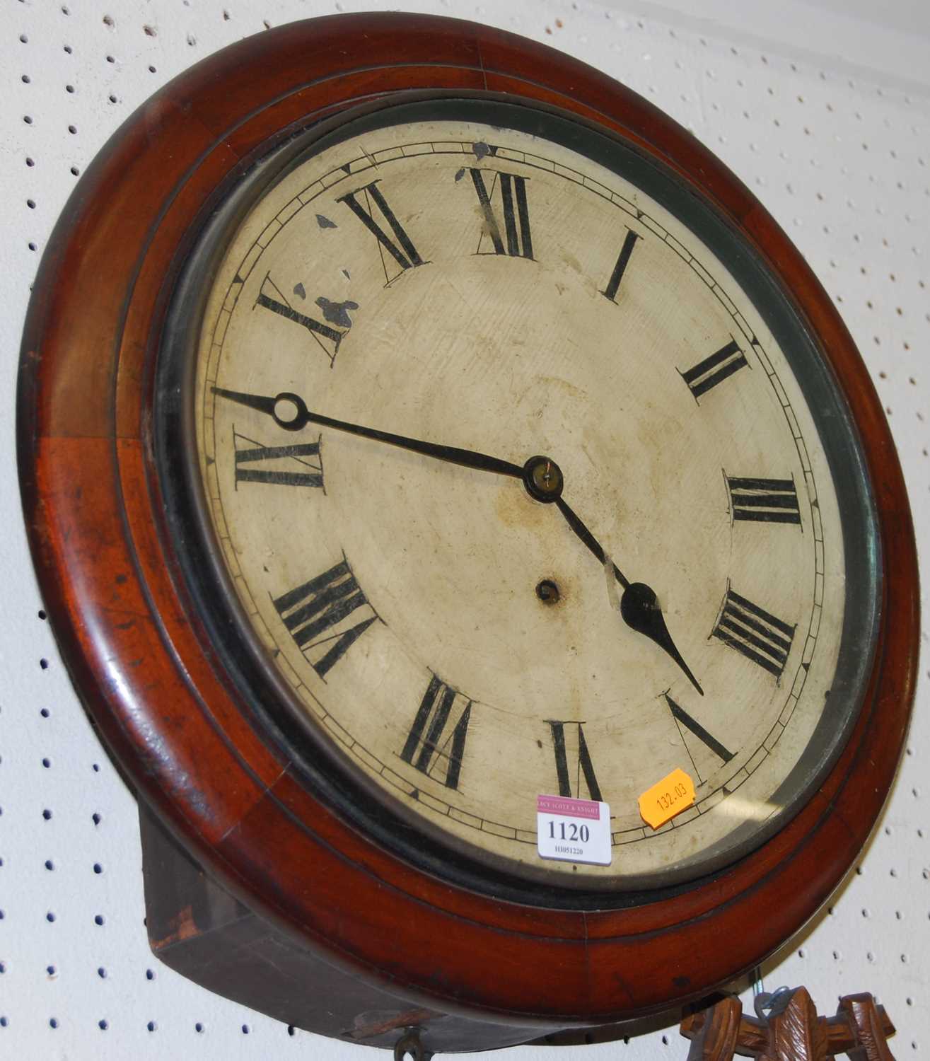 A Victorian mahogany circular wall clock, having a repainted dial, single winding hole with thirty