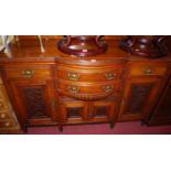 An Edwardian carved walnut sideboard, width 150cm