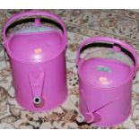 Two galvanised metal and later pink painted watering cans