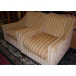 A pair of contemporary corderoy striped upholstered armchairs, each with cushion seats, raised on