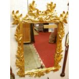 A contemporary French style floral pierced gilt framed bevelled rectangular wall mirror, 124 x 81cm