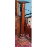 A Victorian mahogany pedestal plant stand having fluted and floral carved column, height 135.5cm