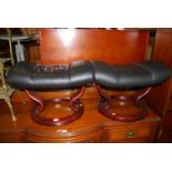 A pair of contemporary formed laminated framed and black leather upholstered foot stools, each width