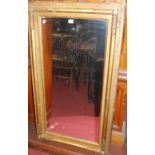 A late 19th century gilt framed rectangular pier mirror, having raised moulded frame, 113 x 64cm