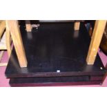 A large 1980s black ash low square section coffee table, w.120cm