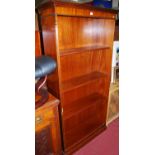 A reproduction mahogany freestanding open bookshelf, width 91.5cm