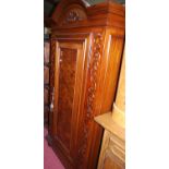 A reproduction walnut and figured walnut Continental single door wardrobe, width 111cm