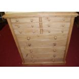 A reclaimed pine chest of six short drawers over five further long drawers, with recessed panel