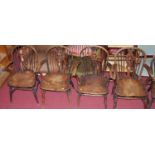 Six similar early 20th century elm wheel and stick back elbow chairs