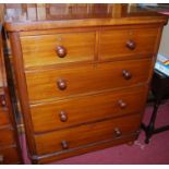 A Victorian mahogany chest of two short over three long drawers on turned feet, width 99cm