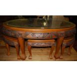 A contemporary Eastern hardwood oval nest of occasional tables, the largest w.127cm
