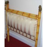 A pair of simulated bamboo framed single headboards, each with striped upholstered insets, with gilt