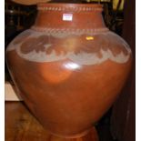 A large painted terracotta planter, of shouldered tapering form, with incised floral banded