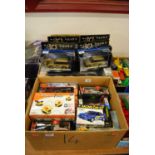Two boxes containing a quantity of modern issue diecast and plastic toys; and a box of mixed 0 gauge