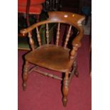An early 20th century elm and beech captain's chair, width 62cm