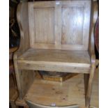 A contemporary rustic stained pine twin panelled single seat settle, w.72cm