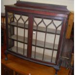 An early 20th century mahogany ledgeback bowfront double door china display cabinet, width 122.5cm