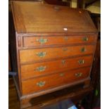 An early 19th century provincial oak slopefront four drawer writing bureau, w.94.5cm