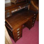 An early 20th century oak rolltop kneehole desk, each pedestal with four drawers and upper pull-