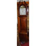 An early 19th century provincial oak and mahogany crossbanded long case clock, the arch painted dial