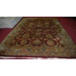 A large Chinese Superwash red ground carpet with all over floral stylised ground, 420 x 302cm