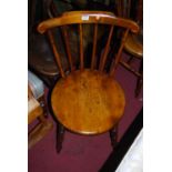 A set of four early 20th century elm and beech stickback pub chairs