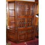 A contemporary Old Charm linenfold moulded oak and lead glazed wall unit, with pair of end corner