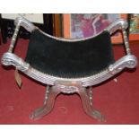 A silver painted X-framed stool