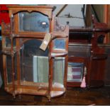 An Edwardian walnut mirrored hanging wall shelf, together with a further Edwardian walnut wall shelf