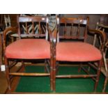 A pair of early 20th century fruitwood barback elbow chairs, each having upholstered stuffover seats