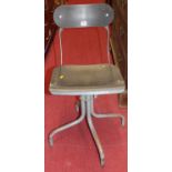 A set of three 1950s Tan-Sad swivel machinist's chairs, raised on grey painted tubular steel