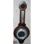 A 1930s oak aneroid two dial wheel barometer