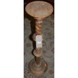 A contemporary faded hardwood spiral turned plant-stand, h.97cm