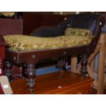 A Victorian mahogany child's rexine upholstered scroll end chaise longue raised on turned