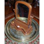 Two Eastern engraved circular brass trays; together with a Victorian mahogany swing toilet mirror (