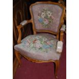 A Louis XV style beech floral tapestry upholstered and further studded single fauteuil, width 60cm